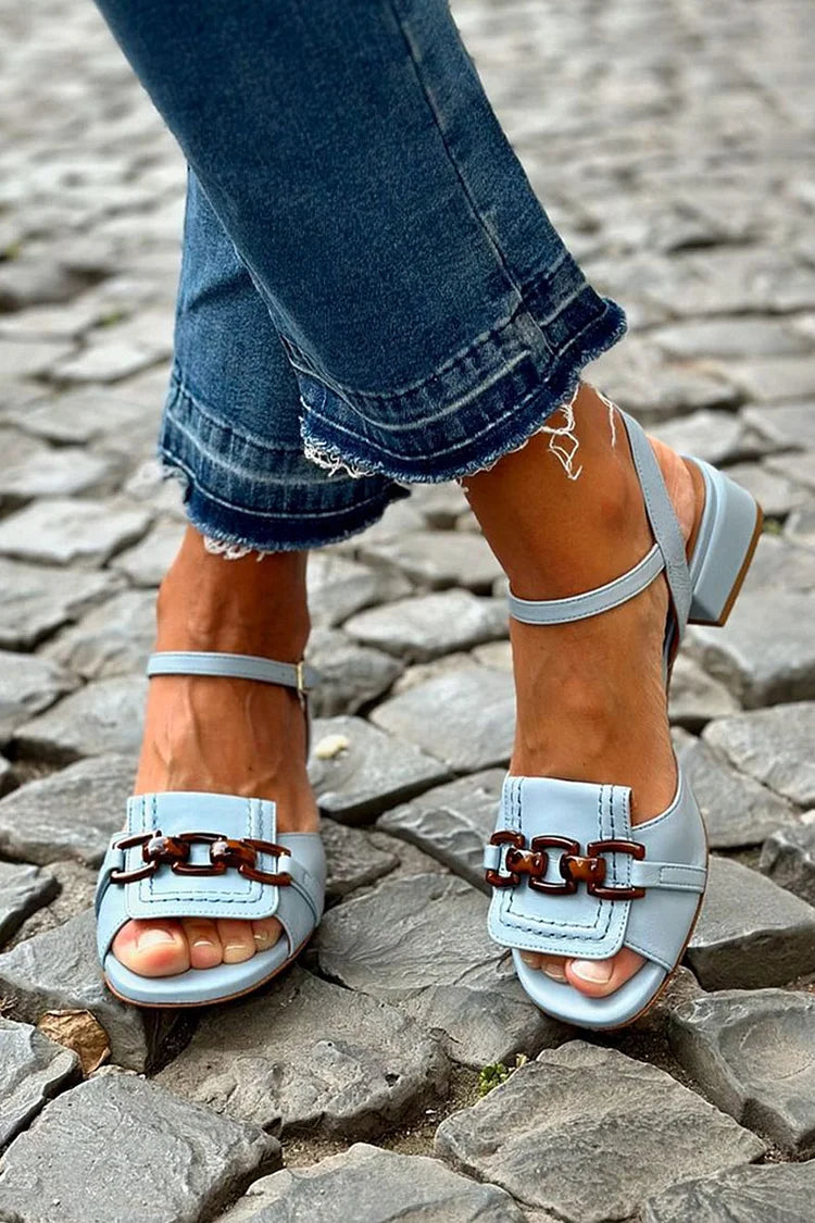 Close-up of Florence sandal chain buckle detail
