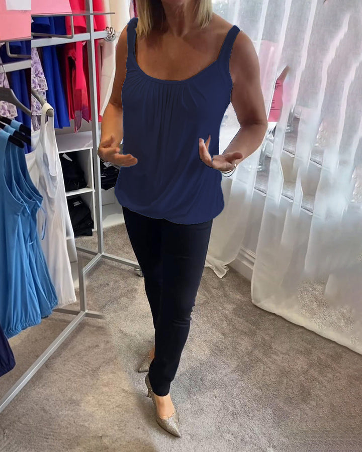 Nancy pleated sleeveless top in navy, front view with hands