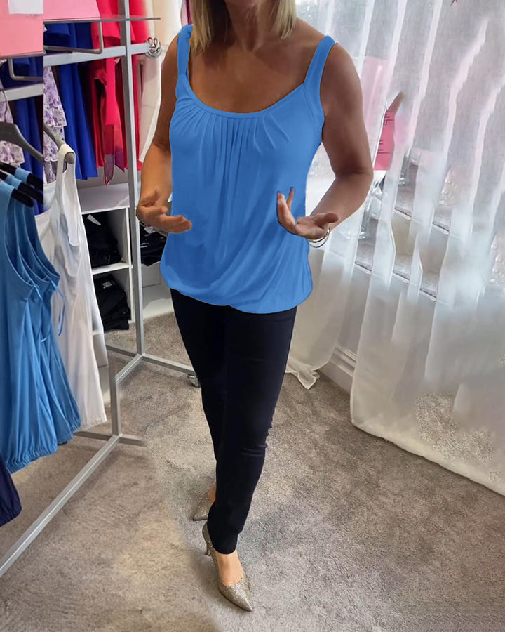 Nancy pleated sleeveless top in blue, front view with hands