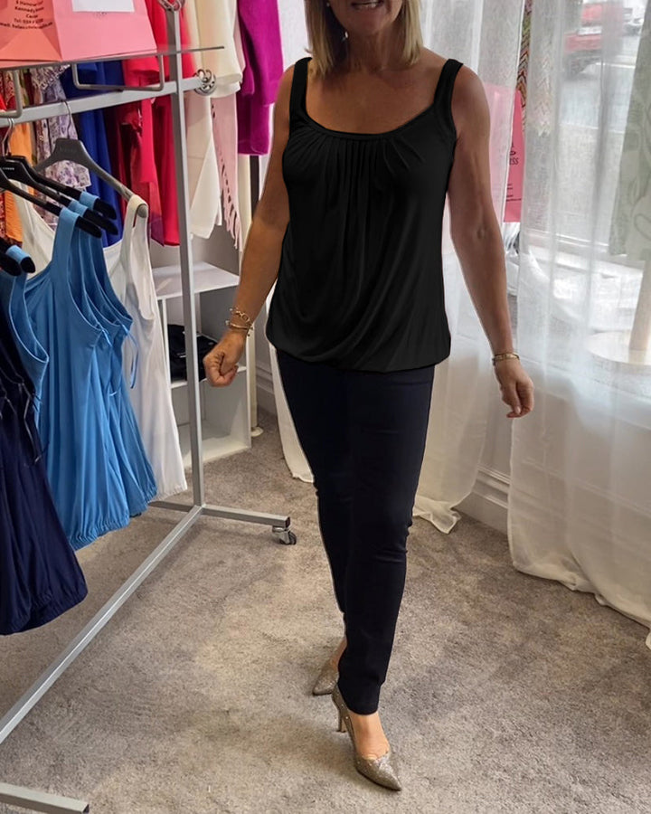 Nancy pleated sleeveless top in black, full-length walking shot