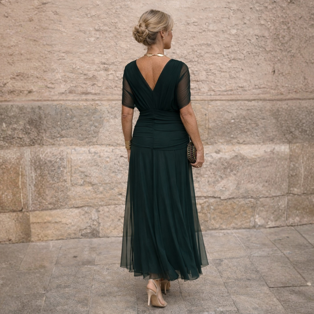 Norma off-shoulder chiffon dress in dark green, back view