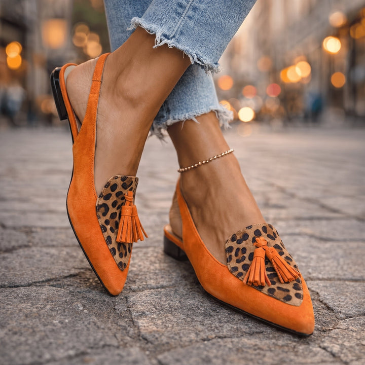 Beverly strappy tassel sandals worn on foot